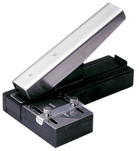 Stapler-Style Slot Punch with Adjustable Guide